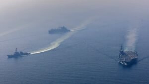 US warns Iran to make a deal as it steps up military deployments