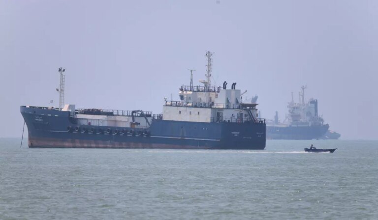 Iran moves to control commercial shipping in Strait of Hormuz, issues warning after vessel is struck